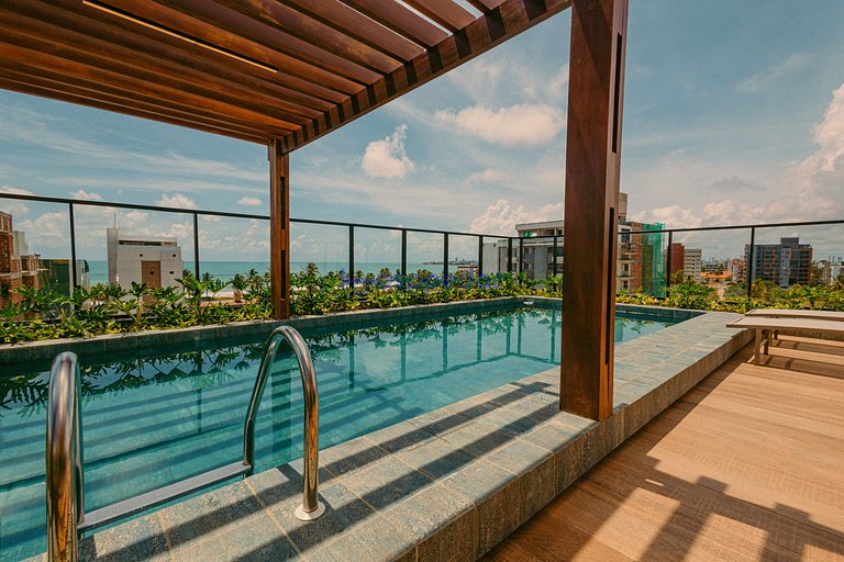 Flat novo c/ piscina rooftop próx. ao mar