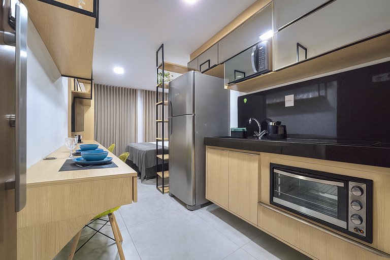 Studio perto de tudo com rooftop e piscina