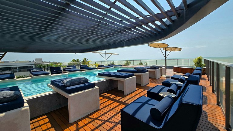 Studio luxo pé na areia com vista lateral para mar