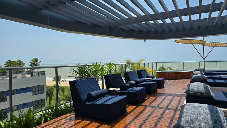 Studio luxo pé na areia com vista lateral para mar