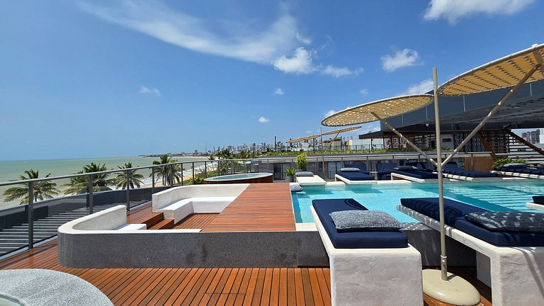 Studio luxo pé na areia com vista lateral para mar