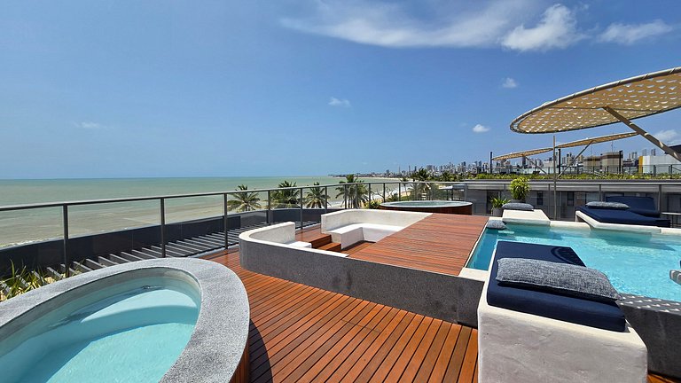 Studio luxo pé na areia com vista lateral para mar