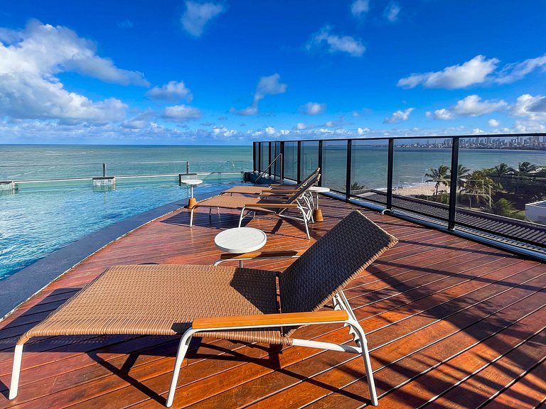 Pé na areia, vista lateral, piscina, academia